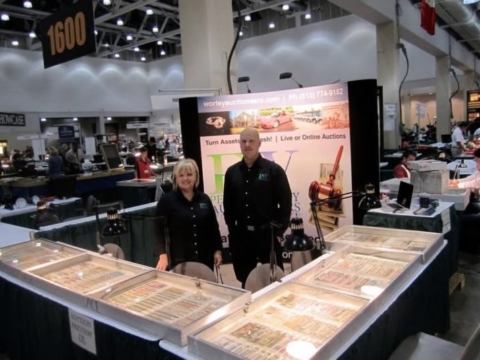 Auctioneers Penny Worley & Jerry Jenkins at their trade booth of the Worlds Fair of Money in Boston, Mass.